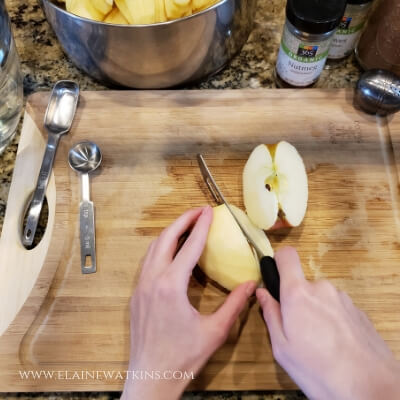 Chopping apples for this easy homemade cinnamon apple sauce